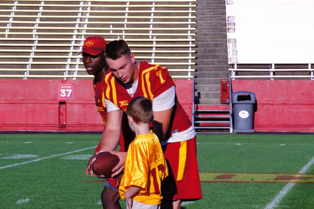 Joel Laning hands off for a touchdown as Mike Warren leads the way at ISU's Victory Day on Aug. 27, 2016. 