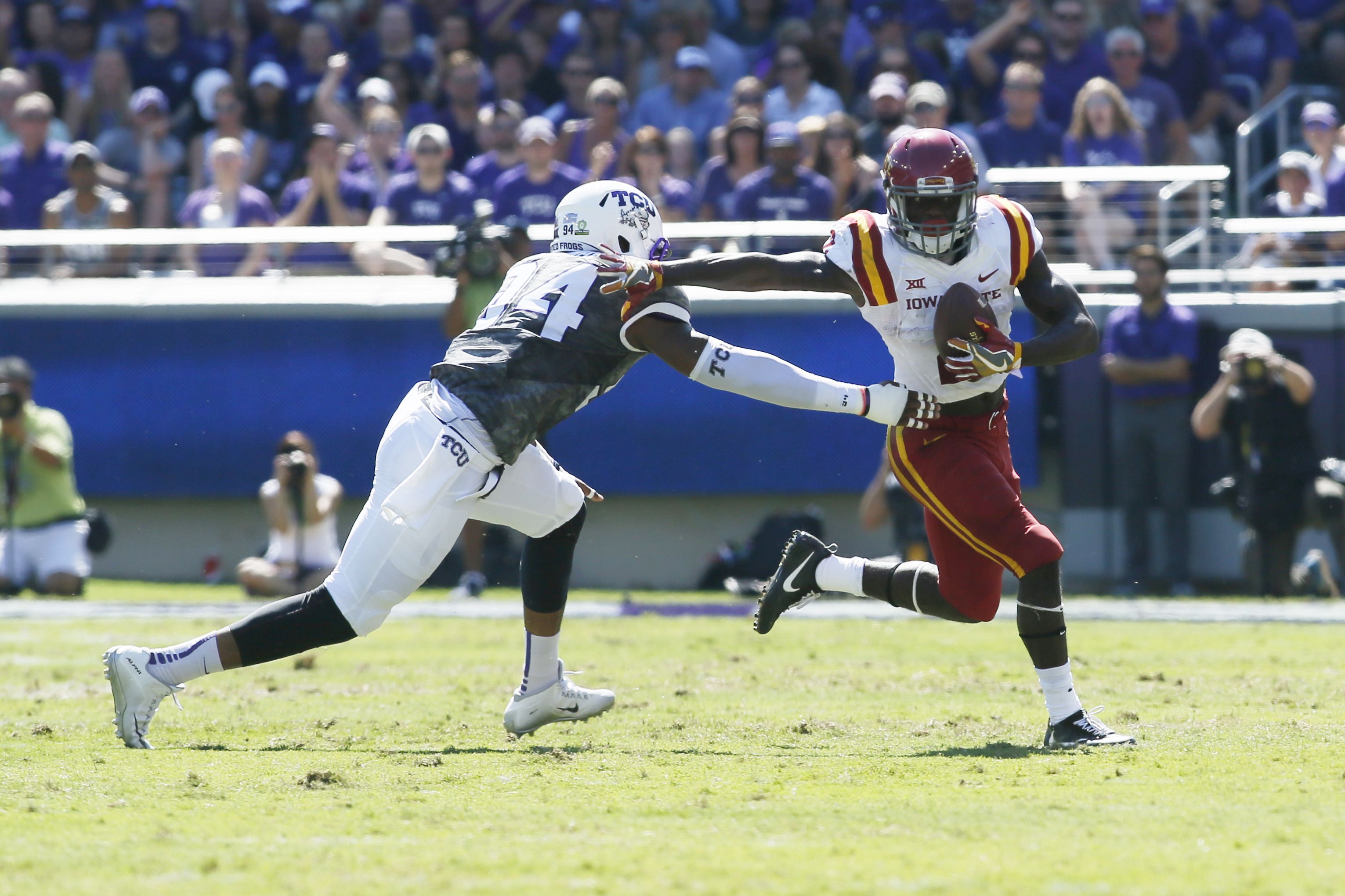 Sep 17, 2016; Fort Worth, TX, USA; Iowa State Cyclones running back Mike Warren (2) runs the ball against TCU Horned Frogs defensive end Josh Carraway (94) in the first quarter at Amon G. Carter Stadium. Mandatory Credit: Tim Heitman-USA TODAY Sports