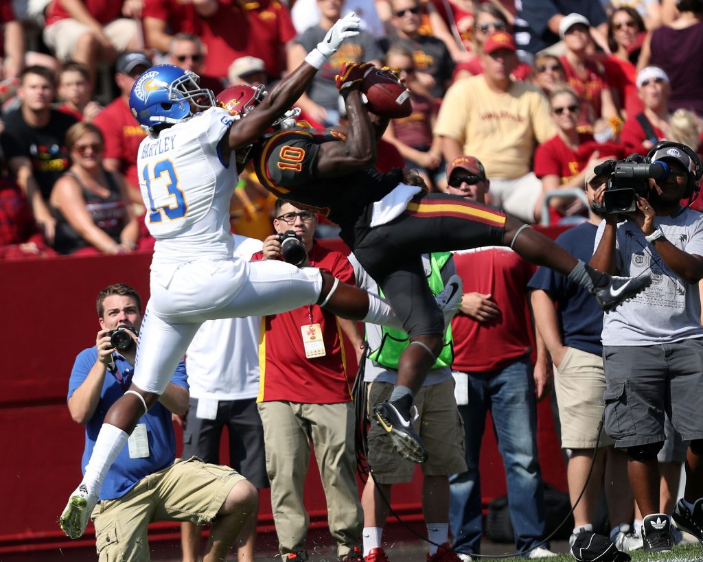 Sep 24, 2016; Ames, IA, USA; Iowa State Cyclones defensive back Brian Peavy (10) intercepts a pass in front of San Jose State Spartans wide receiver Tre Hartley (13) at Jack Trice Stadium. Mandatory Credit: Reese Strickland-USA TODAY Sports