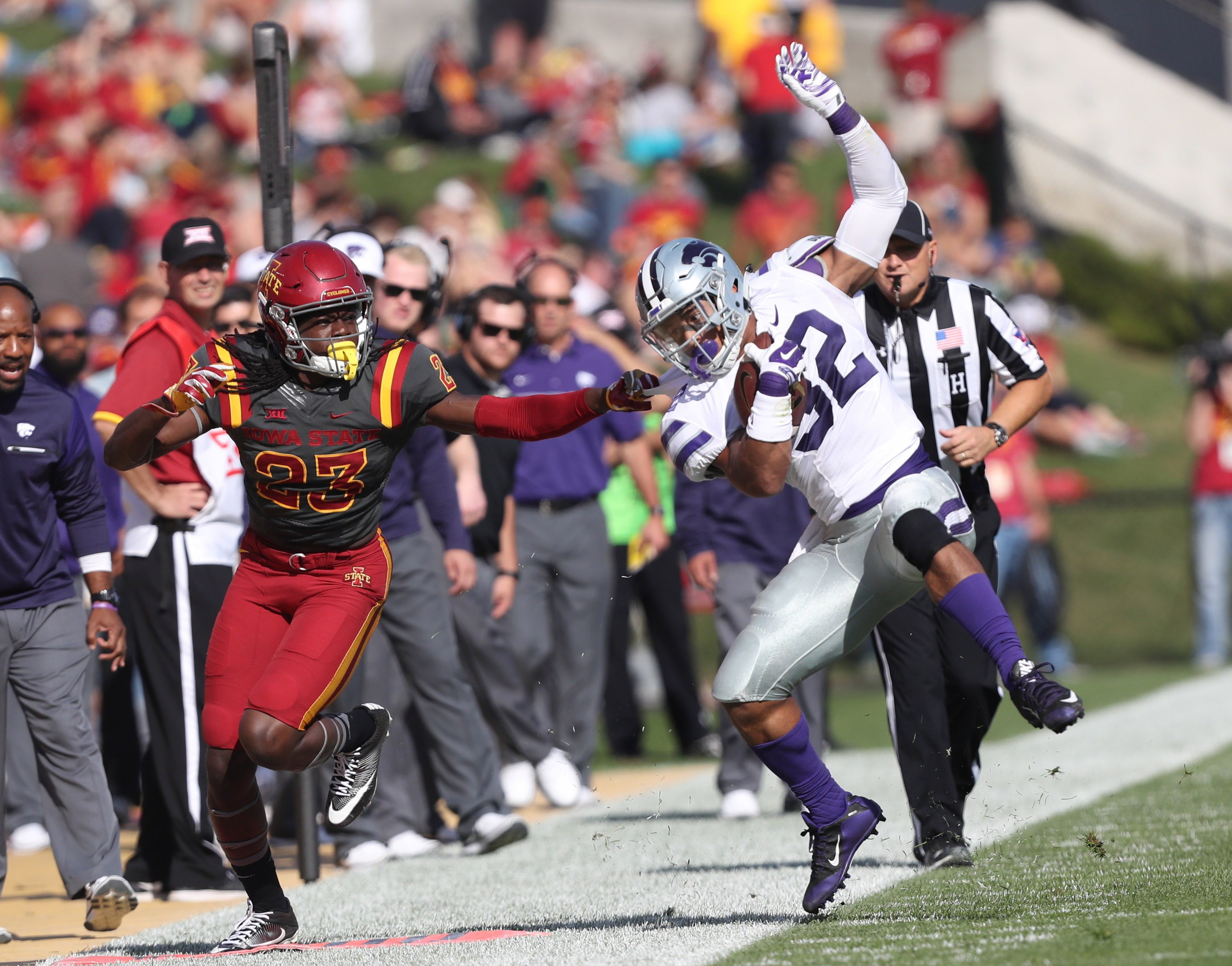 Oct 29, 2016; Ames, IA, USA; Kansas State Wildcats running back Justin Silmon (32) is tackled by Iowa State Cyclones defensive back Thadd Daniels (23) at Jack Trice Stadium. Mandatory Credit: Reese Strickland-USA TODAY Sports