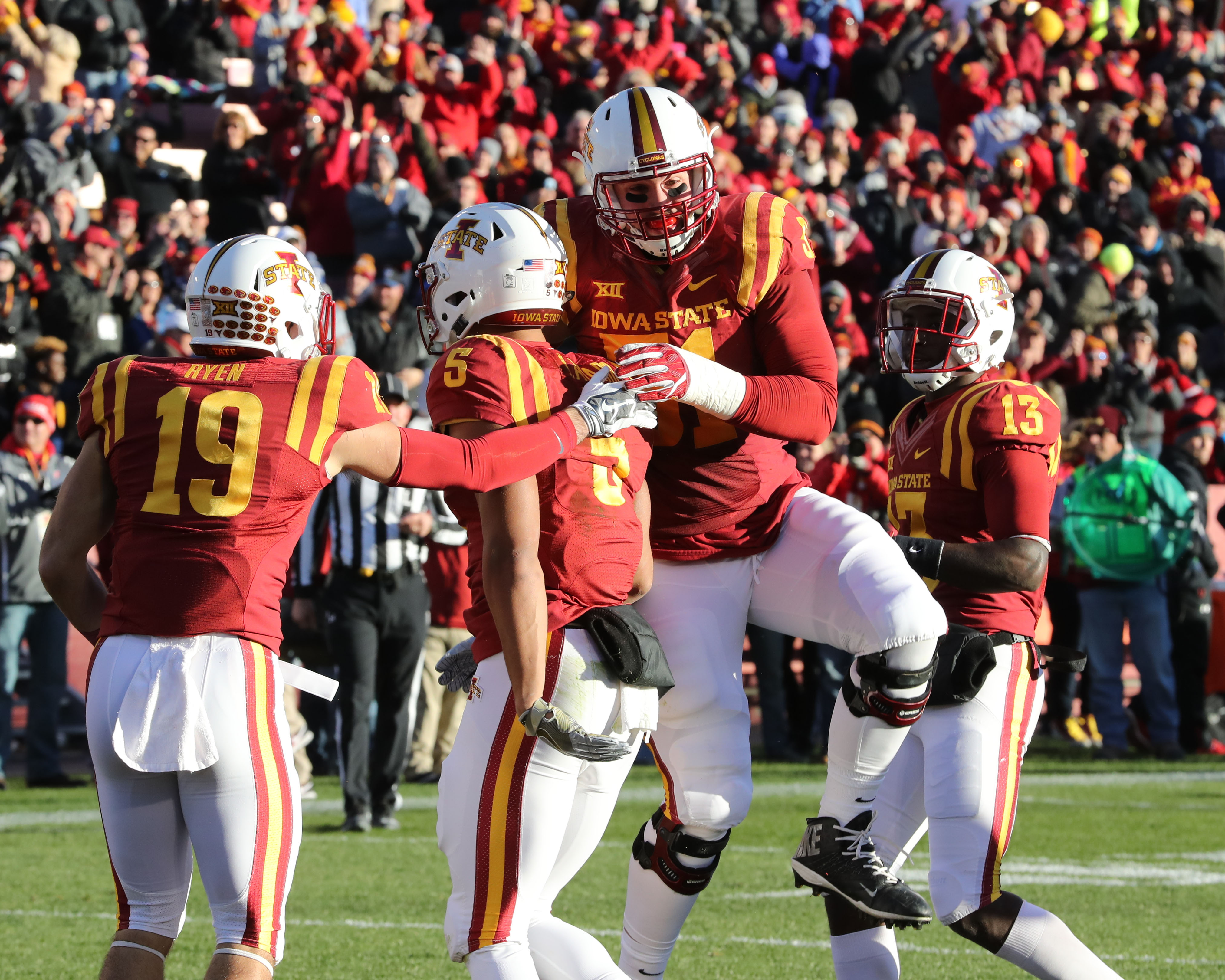 Nov 19, 2016; Ames, IA, USA; Iowa State Cyclones wide receiver Allen Lazard (5) celebrates with Iowa State Cyclones offensive lineman Julian Good-Jones (51) and Iowa State Cyclones wide receiver Trever Ryen (19) after scoring against the Texas Tech Red Raiders at Jack Trice Stadium. Mandatory Credit: Reese Strickland-USA TODAY Sports