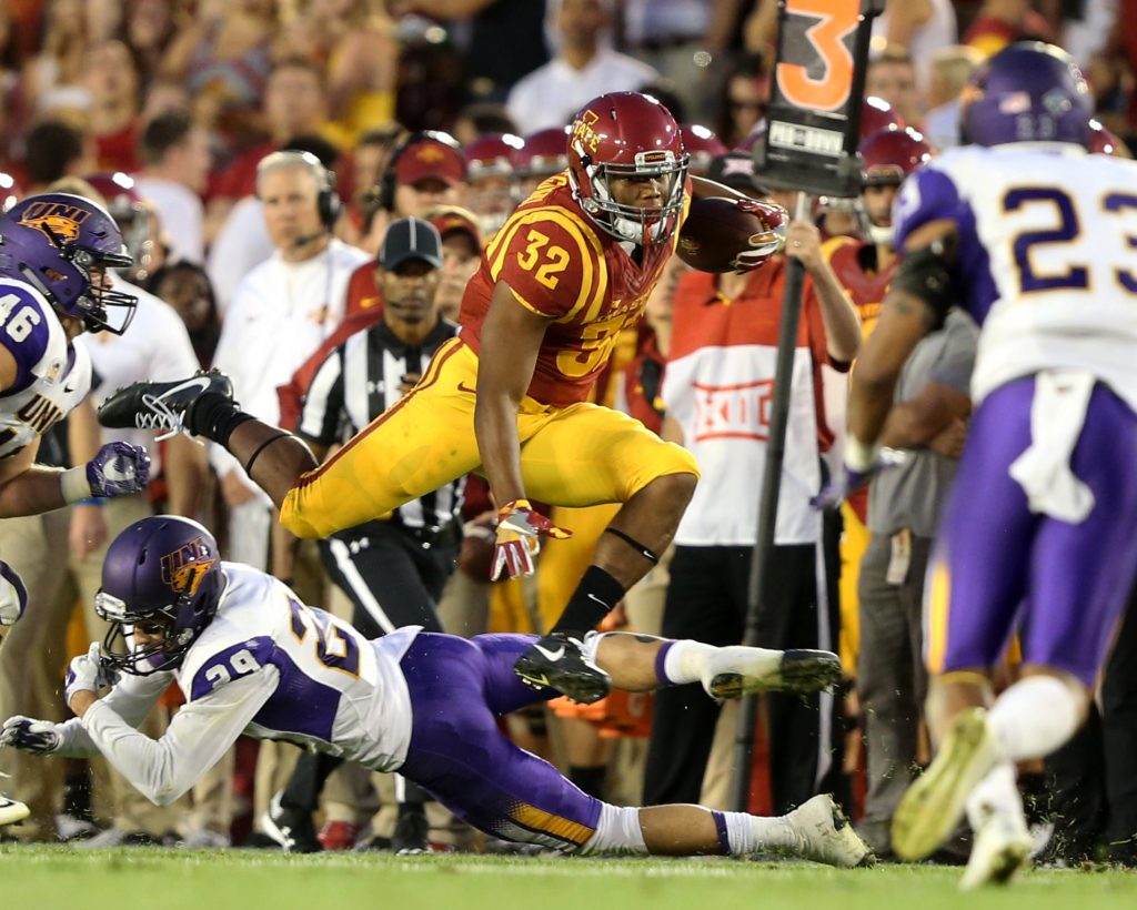 Sep 3, 2016; Ames, IA, USA; Iowa State Cyclones running back David Montgomery (32) hurdles Northern Iowa Panthers defensive back Jamison Whiting (29) during the first half at Jack Trice Stadium. Mandatory Credit: Reese Strickland-USA TODAY Sports