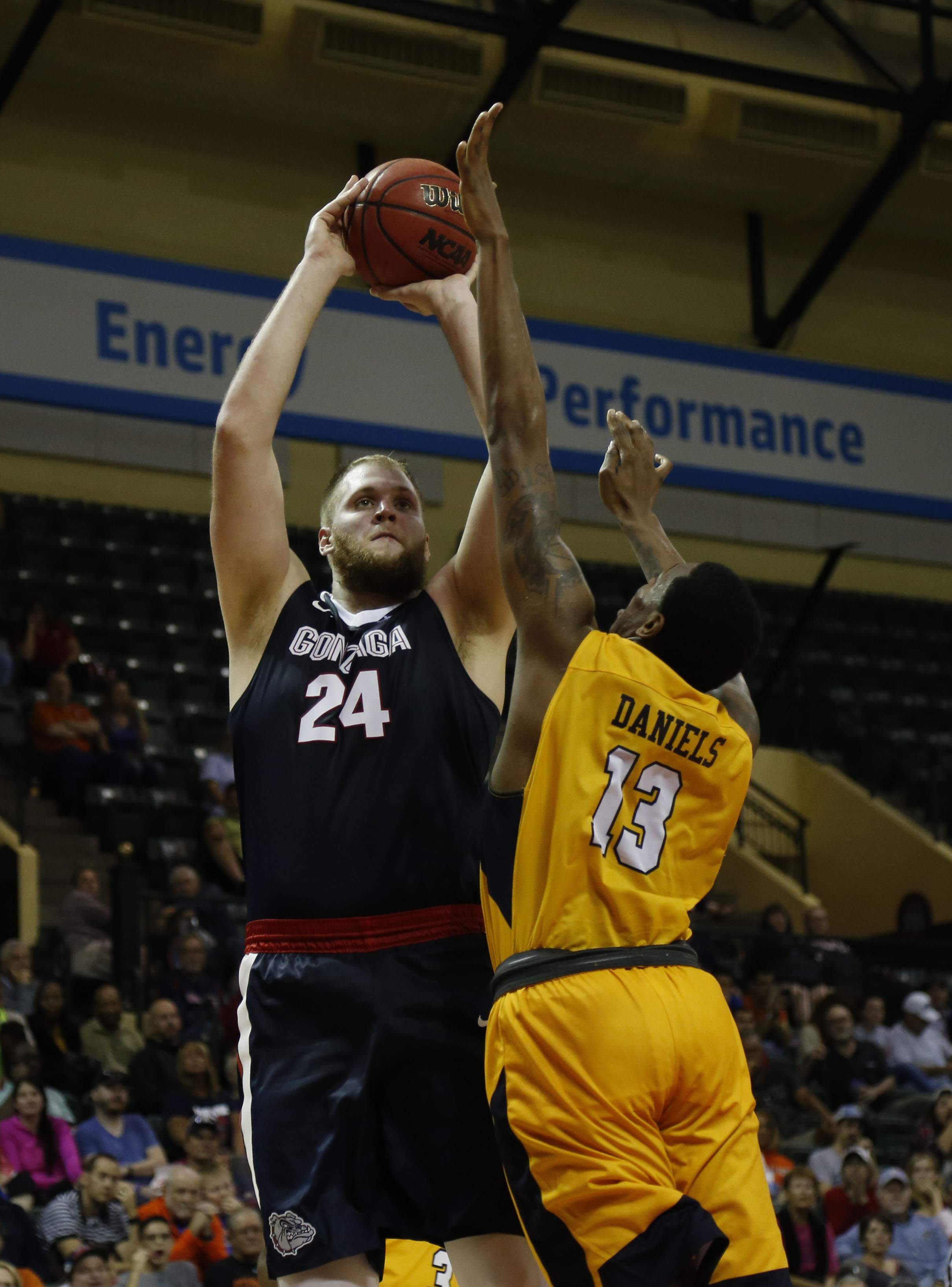 Nov 24, 2016; Kissimmee, FL, USA; Gonzaga Bulldogs center Przemek Karnowski (24) shoots over Quinnipiac Bobcats forward Chaise Daniels (13) during the second half at HP Field House. Gonzaga Bulldogs defeated the Quinnipiac Bobcats 82-62. Mandatory Credit: Kim Klement-USA TODAY Sports