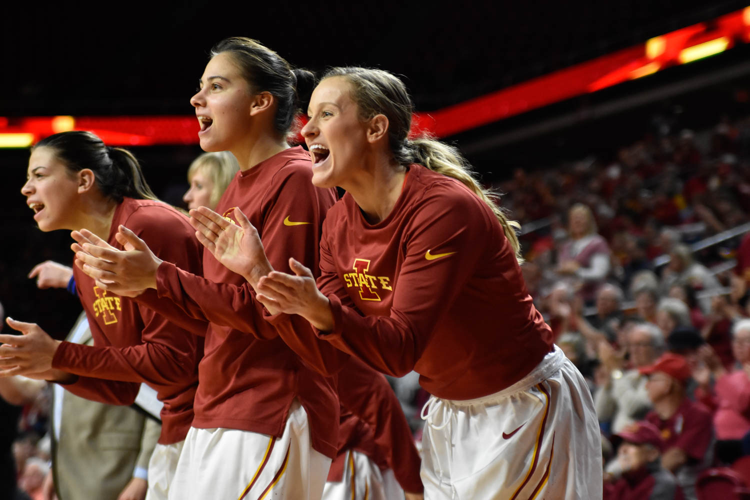 Senior guard Lexi Albrecht cheers for the Cyclones at the basketball game against UNI at Hilton Coliseum on Nov. 15. ISU won 76-68. Credit: Lani Tons