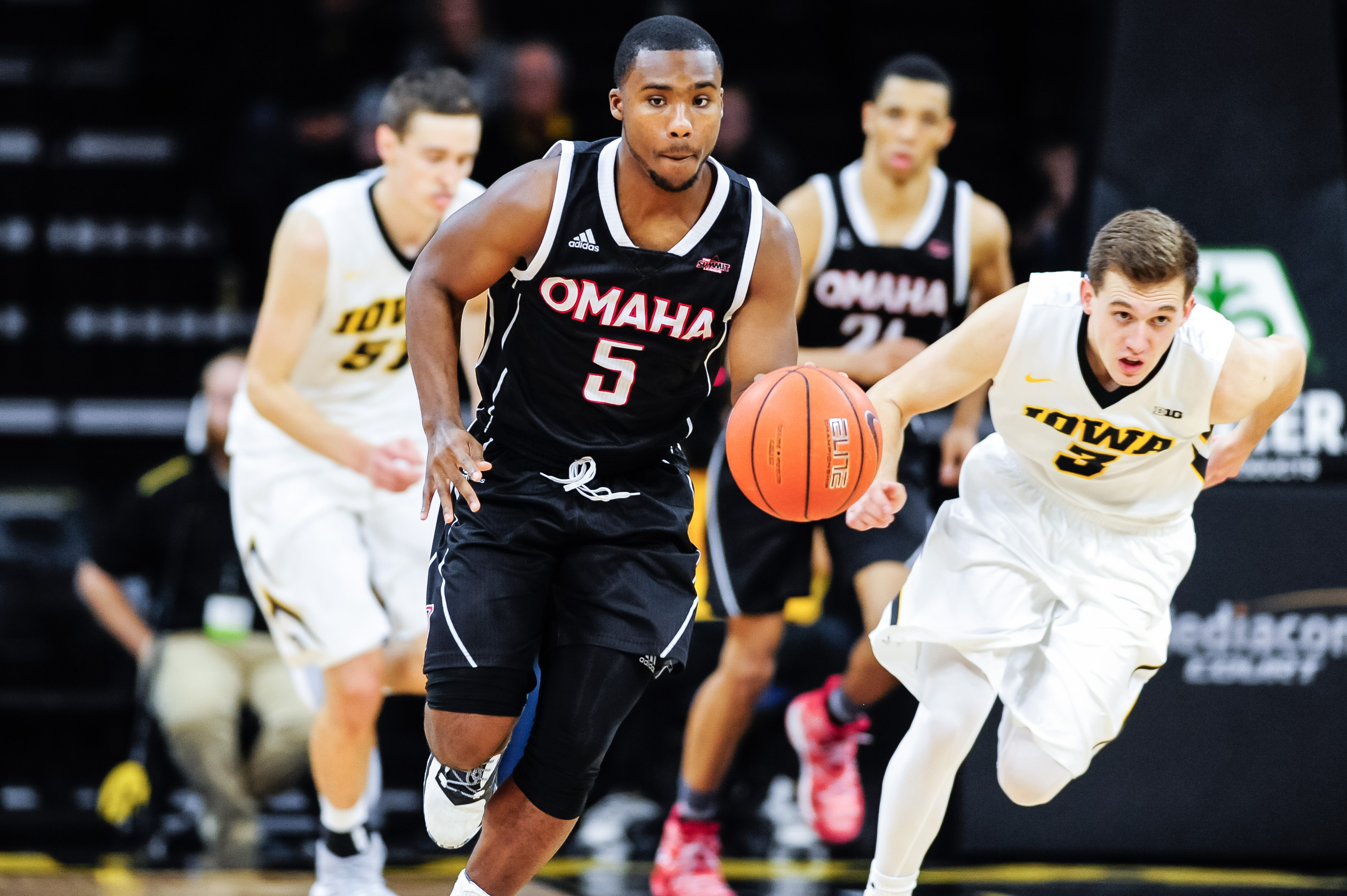 Dec 3, 2016; Iowa City, IA, USA; Nebraska-Omaha Mavericks guard KJ Robinson (5) brings the ball up court as Iowa Hawkeyes guard Jordan Bohannon (3) chases during the second half at Carver-Hawkeye Arena. Nebraska Omaha won 98-89. Mandatory Credit: Jeffrey Becker-USA TODAY Sports